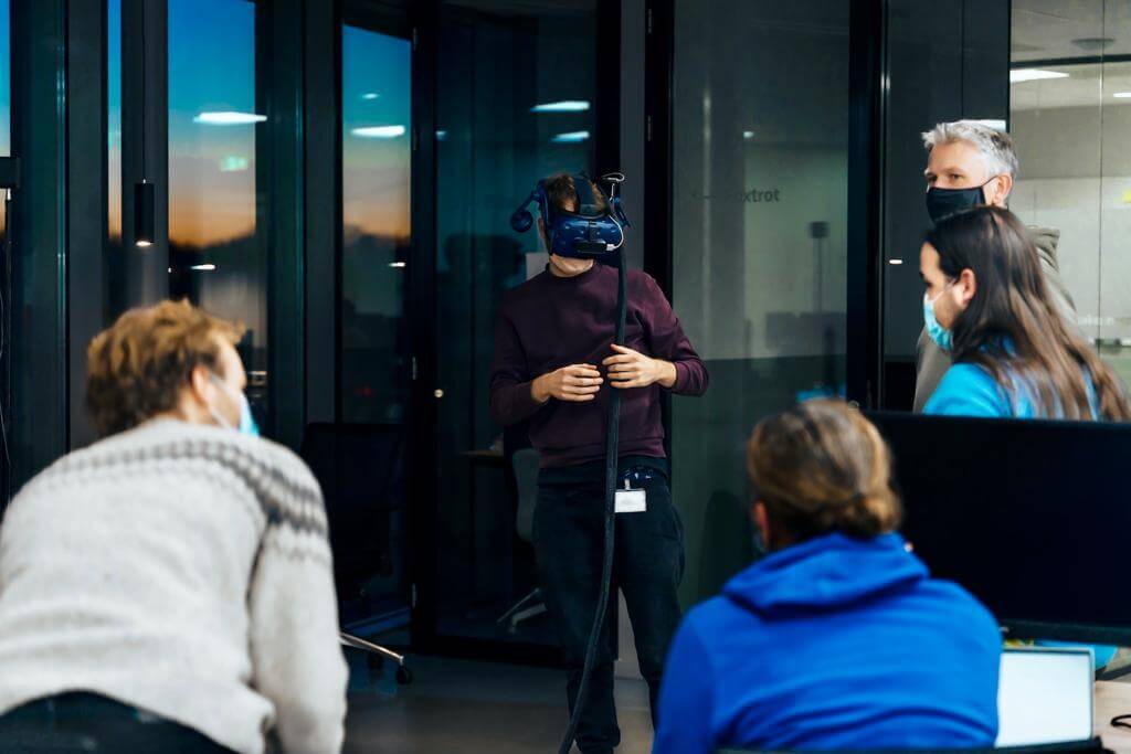 Trying out different interior designs in a VR environment with the team.